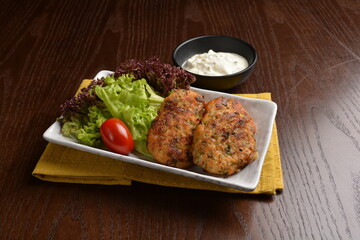 indian Malay style baked potato cake vegetarian with chef special salad tartar sauce on wood table appetiser halal menu