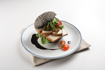vegetarian burger with tofu bean curd, mushroom and vegetables in chef special sauce charcoal bun...