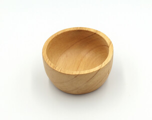 Beautifully carved wooden bowl isolated on white background.