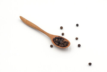 black pepper in a wooden bowl isolated on white background