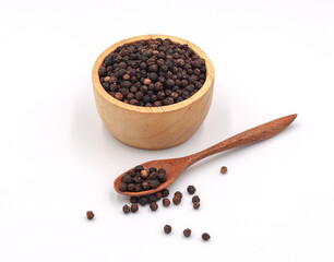 black pepper in a wooden bowl isolated on white background