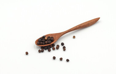 black pepper in a wooden bowl isolated on white background