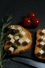 Still life with cheese on a dark background