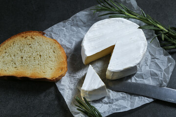 Still life with cheese on a dark background