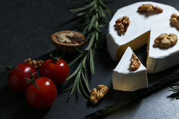 Still life with cheese on a dark background