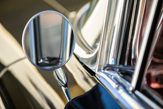 Detail of chrome side mirror on 1960 Old Sport Sedan
