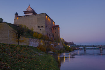 October twilight at the foot of the medieval castle of Hermann. Narva, Estonia
