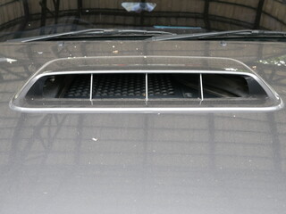 closeup of hood air vent on car bonnet.