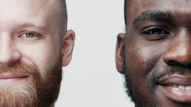 Two Handsome Young Man Smiling Looking at Camera Close-up. Multiethnic Fun Faces of Casual Men. Diversity Concept Positive Youth. African-American and Caucasian Portrait of Joyful Success View Indoors