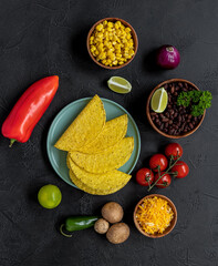 Vegetarian tacos with mushrooms, beans, peppers, and sauce.