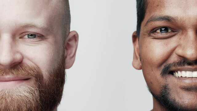 Two Handsome Young Man Smiling Looking at Camera Close-up. Multiethnic Fun Faces of Casual Men. Concept Diversity Positive Youth. Happy Indian and Caucasian Portrait of Joyful Success View Indoors 4k