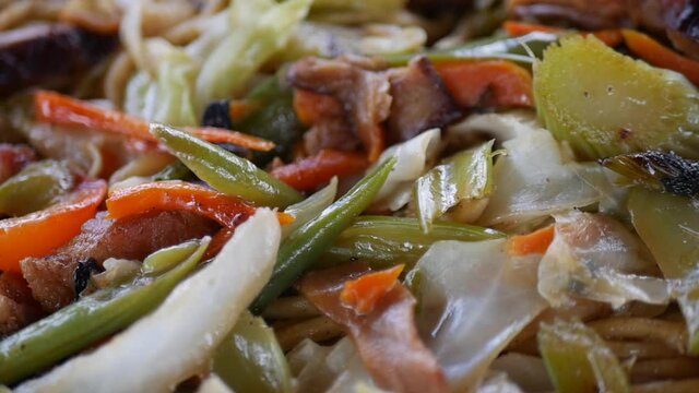 Close up of the many ingredients its takes to make a filipino dish called pancit