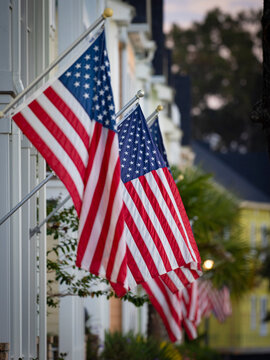 American flags fly on small town street