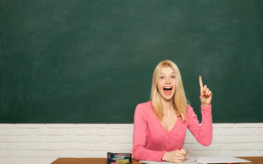 Excited amazed teacher. Portrait of young caucasian female teacher or student. Cheerful teacher on...