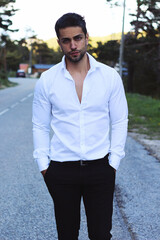 Fototapeta premium Handsome man wearing a white shirt outdoor