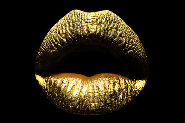 Sexy lips. Closeup sexy beautiful female golden lips isolated. Gold lipstick. Macro of beautiful...