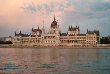 Fototapeta premium Hungarian House of Parliament Building in Budapest, Hungary, on the River Danube at Dusk in the Evening