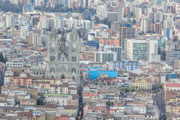 Quito is the capital city of Ecuador. Basilica of the National Vow is found in the colonial center of the city. Photo of cityscape taken from top of mount Panecillo.