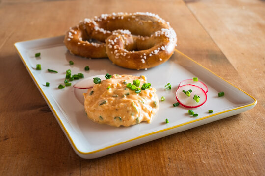 Obatzda, a Bavarian Cheese Spread also called Obatzter or Obazda with a Pretzel called Brezel or Laugenbrezel