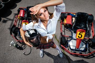 Girl  with helmet in Karting - obrazy, fototapety, plakaty