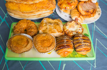Colorful buns served with a plate isolated on tablecloth background. 