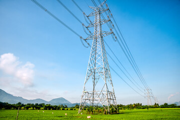 Overhead eletrical transmission line crossing the rice field at Philippine countryside