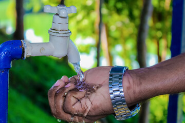 hand with water tap