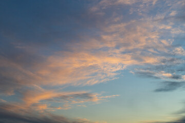 Naklejka na ściany i meble A beautiful sunset sky with some clouds.