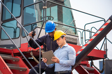 Business man and Starf control checking container yard Organising stock to pack into containers, Unload and loading variety of products to and from container, trucks warehouse. imported product, Logis