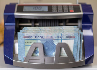 Lebanese Lira Currency in a money counting machine