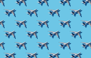 Pattern of plane models on blue pastel background