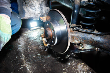 repair of brake discs of a car in the garage.