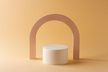Composition with concrete arch and cylinder in the style of minimalism on a delicate background