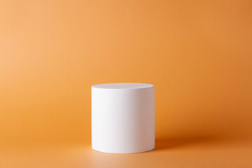 Composition with concrete cylinders in the style of minimalism on delicate background