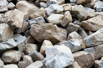 boulders, pebbles and sand from the bottom of a mountain river