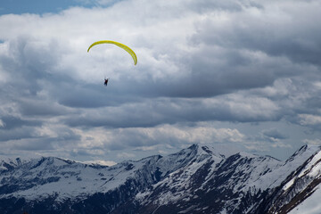 paragliding in mountains near Gudauri in Georgia