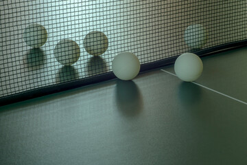 Table tennis balls on a blurred background.