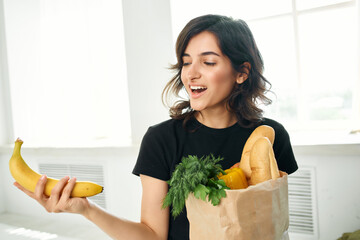 brunette with a package of products cooking health food delivery