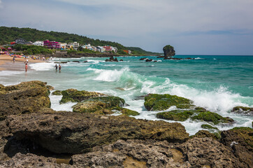Chuanfanshi coastal reef and sea waves with the azure sky in the Kenting National Park of Pingtung,...