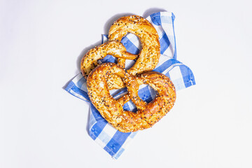 Oktoberfest concept - pretzels on a traditional napkin isolated on white background