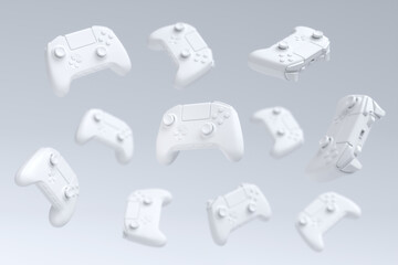 Flying gamer joysticks or gamepads on white background with blur