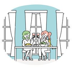 仕事帰りにレストランで食事をする女性たち