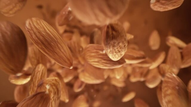 Super Slow Motion Detail Shot of Almonds Flying Towards Camera at 1000 fps.