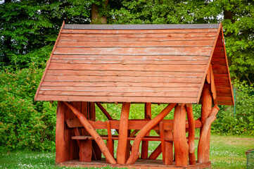 VERSMOLD, GERMANY. JUNE 20, 2021 Campingpark Sonnensee. Wooden gazebo in a country style on a green meadow.