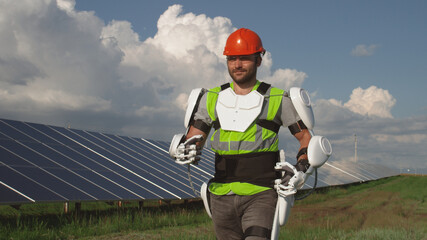 Solar farm worker walking in exoskeleton