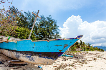Blue and white fishing boat on the beach of Gili Air, Indonesia, Southeast Asia