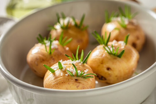 Homemade baked potatoes with salt and rosemary. Swedish cuisine.