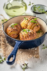 Delicious baked potatoes with herbs and oil. Scandinavian cuisine.