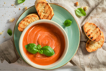 Homemade tomato soup made of tasty tomatoes. Soup with croutons.