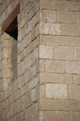 Traditional stone wall decorates building in costruction, Cyprus